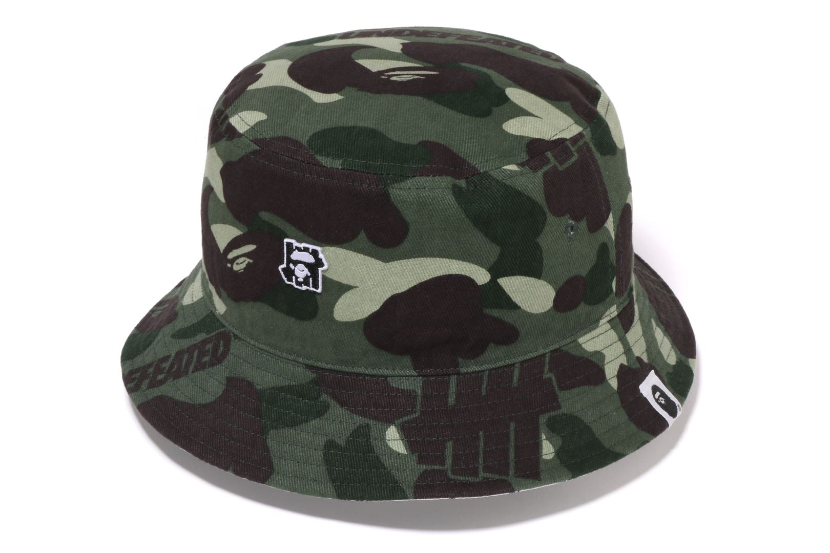 BAPE® X UNDEFEATED COLOR CAMO FLANNEL BUCKET HAT