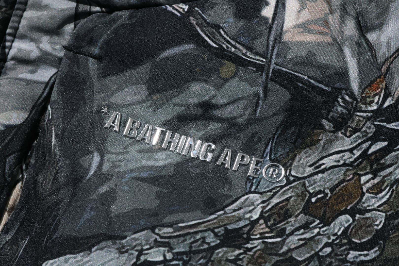 A BATHING APE® Tree Edge Camo Metal Logo Down Jacket | Bape